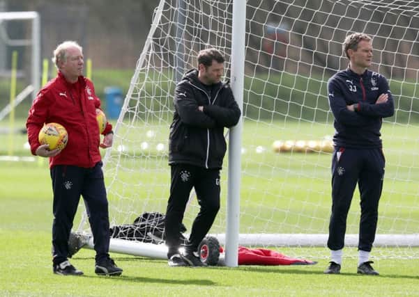 Rangers manager Graeme Murty, centre, takes a moment for quiet reflection during training. Picture: PA.
