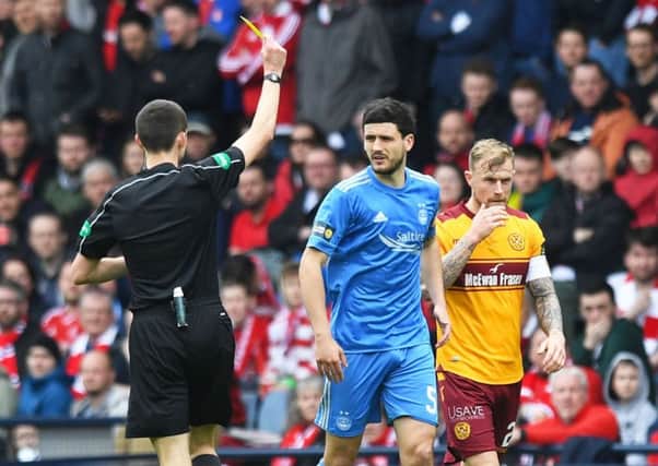 Aberdeen's Anthony O'Connor is booked during the Scottish Cup semi-final defeat by Motherwell. Picture: Craig Williamson/SNS