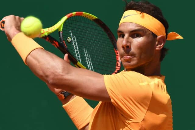 Rafael Nadal plays a backhand return in the win over Austrias Dominic Thiem in Monte Carlo. Picture: AFP/Getty