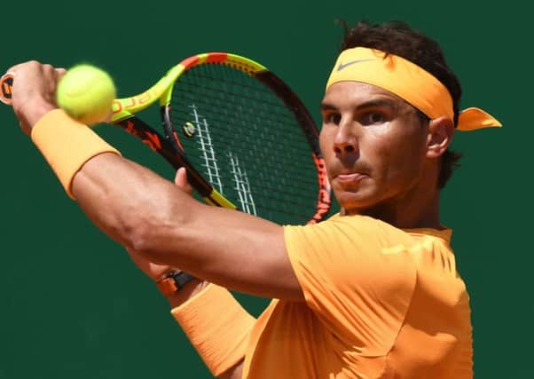 Rafael Nadal plays a backhand return in the win over Austrias Dominic Thiem in Monte Carlo. Picture: AFP/Getty