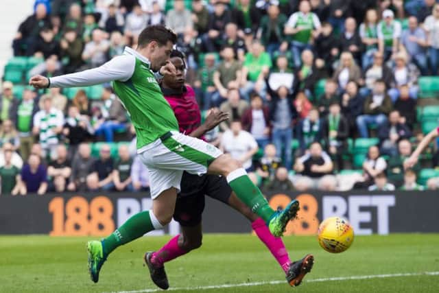 Jamie Maclaren beats Dedryck Boyata to the ball to fire Hibs into the lead against Celtic. Picture: Alan Harvey/SNS