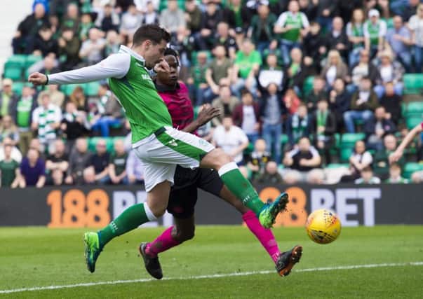 Jamie Maclaren beats Dedryck Boyata to the ball to fire Hibs into the lead against Celtic. Picture: Alan Harvey/SNS
