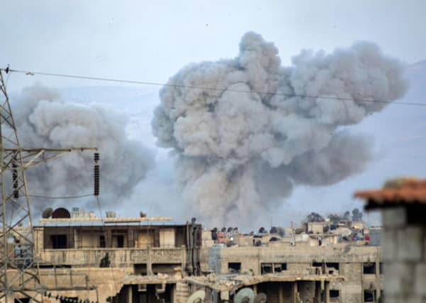 Smoke billows in a southern district of the Syrian capital Damascus. Picture: AFP/Getty