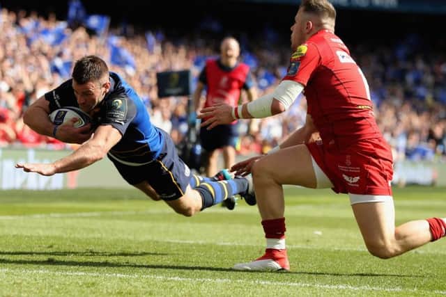 Steff Evans is left clutching at fresh air as Fergus McFadden goes over for Leinsters third try. Photograph: David Rogers/Getty