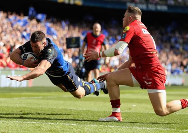 Steff Evans is left clutching at fresh air as Fergus McFadden goes over for Leinsters third try. Photograph: David Rogers/Getty