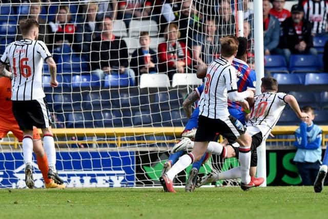 Dunfermlines Nicky Clark heads in a free kick to make it 2-2 with just seconds remaining .  Photograph: Gary Hutchison/SNS