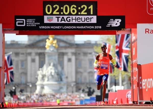 Mo Farah crosses the finish line to take third place during the Virgin Money London Marathon. Picture: Getty Images