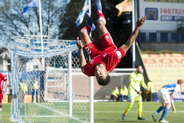 Shay Logan performs his customary cartwheel and back flip after doubling Aberdeens advantage. Picture: SNS.