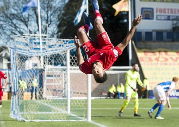 Shay Logan performs his customary cartwheel and back flip after doubling Aberdeens advantage. Picture: SNS.