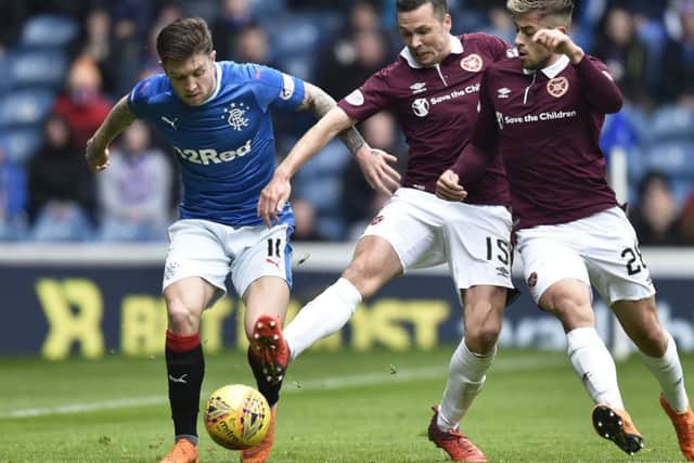 Rangers' Josh Windass in action with Hearts' Don Cowie (centre) and Marcus Godinho. Picture: SNS/Rob Casey