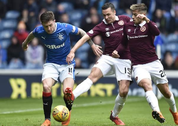 Rangers' Josh Windass in action with Hearts' Don Cowie (centre) and Marcus Godinho. Picture: SNS/Rob Casey