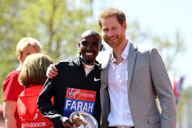 Mo Farah, who posed with Prince Harry after completing the London Marathon, wants to keep learning at his new distance. Picture: Getty.