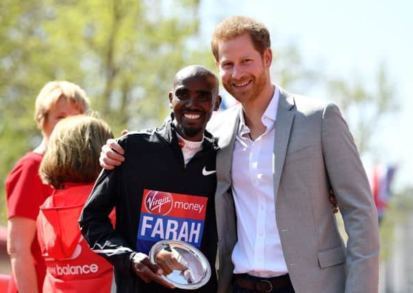 Mo Farah, who posed with Prince Harry after completing the London Marathon, wants to keep learning at his new distance. Picture: Getty.