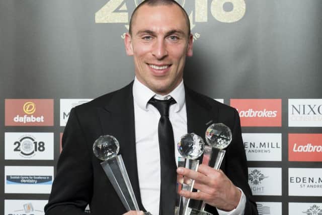 Captain Scott Brown is pictured with his three trophies from the Celtic awards evening - Players Player, Player and a Special Recognition Award. Picture: Alan Harvey/SNS