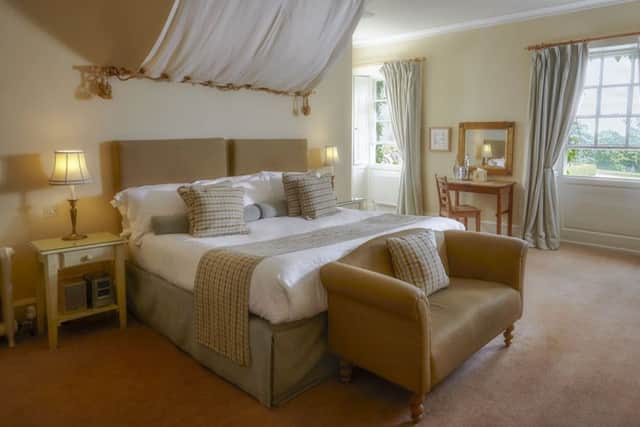 Country house extravagance in a bedroom at Swinton Park Hotel, Masham, Ripon, North Yorkshire