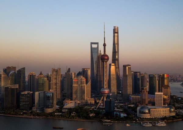 The towering skyline of Pudong, the financial district of Shanghai, shows the rise of the East (Picture: AFP/Getty)