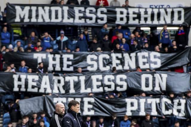 Rangers manager Graeme Murty gets the message during the 2-1 win over Hearts at Ibrox on Sunday. Picture: SNS