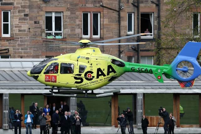 Scotland's Charity Air Ambulance (SCAA) flying into Holyrood Park in Edinburgh. Picture: Andrew Milligan/PA Wire