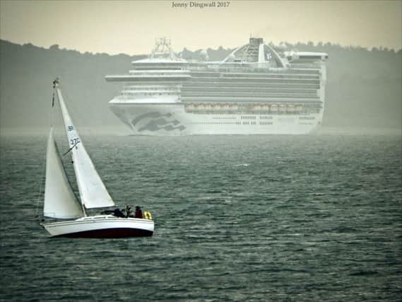 A Burntisland Sailing Club boat passes a cruise ship in the Forth. Pic by Jenny Dingwall.