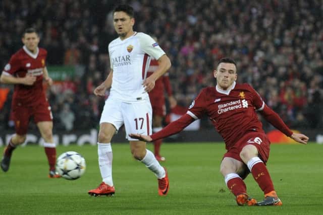 Andy Robertson takes on Cengiz Under of Roma at Anfield in the Champions League semi-final. Picture: AP