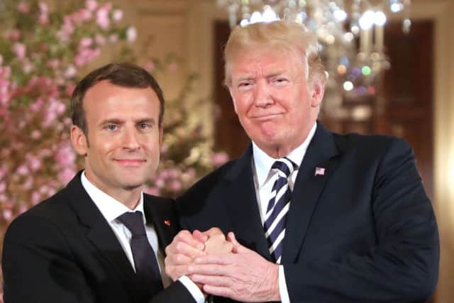 US President Donald Trump and French President Emmanuel Macron shake hands during a joint press conference at the White House. Picture: Getty Images