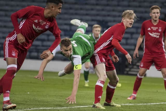 Hibernian Under-20 captain Ryan Porteous nips between the Aberdeen defence to power a header into the net for a 2-1 lead. Picture: John Devlin.