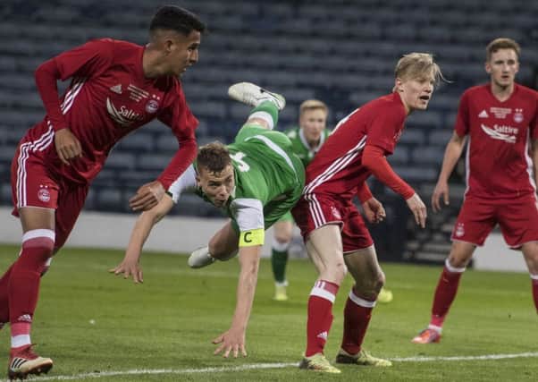 Hibernian Under-20 captain Ryan Porteous nips between the Aberdeen defence to power a header into the net for a 2-1 lead. Picture: John Devlin.