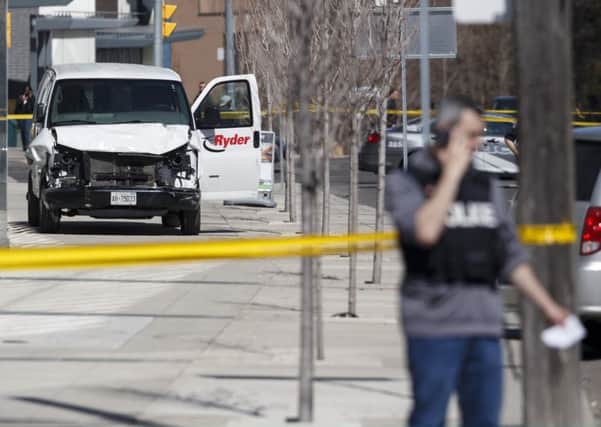 The van that was used to kill ten people in the Toronto attack is cordoned off by police. Picture: Cole Burston/Getty