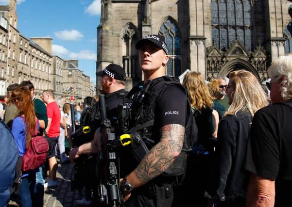 Armed officers will be sent to more incidents from next month. Picture: John Devlin