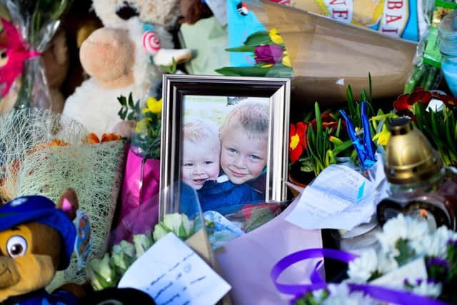 Floral tributes in memory of Corey and Casper Platt-May who were killed. Picture: SWNS