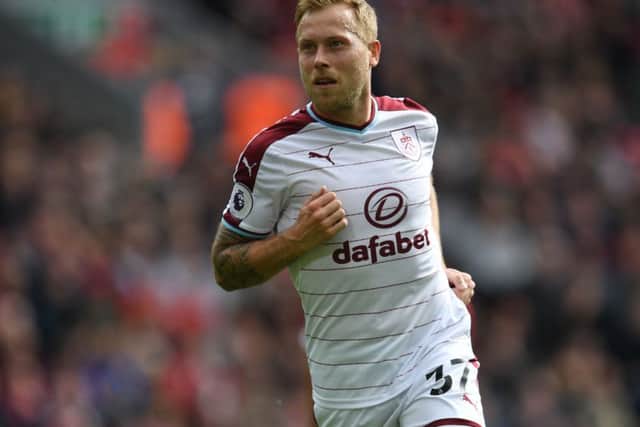 Scott Arfield celebrates after scoring against Liverpool in September 2017. Picture: AFP/Getty Images