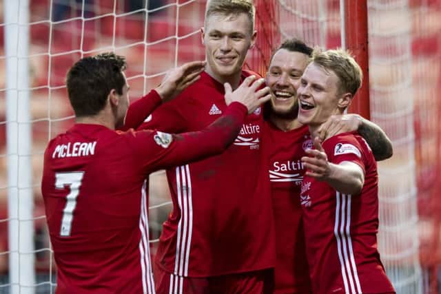 Gary Mackay-Steven celebrates scoring the second goal with his team-mates. Picture: SNS Group