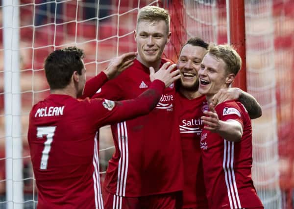 Gary Mackay-Steven celebrates scoring the second goal with his team-mates. Picture: SNS Group