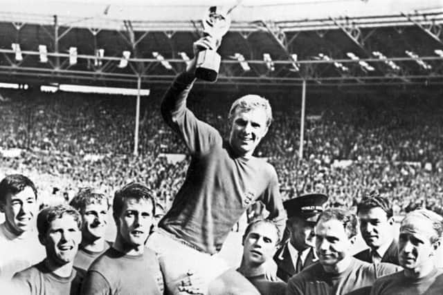 Traditionalists pine for the old Wembleys inspiring history including Bobby Moore with the Jules Rimet trophy. Picture: AFP/Getty Images