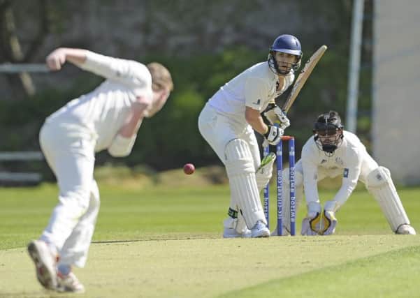 Ally Sadler bowls to Michael Sean of Heriot's on his way to scoring an unbeaten 92 at the crease with RHC's wicketkeeper Elliot Foster standing up to the wicket. Photograph:


 Neil Hanna Photography
