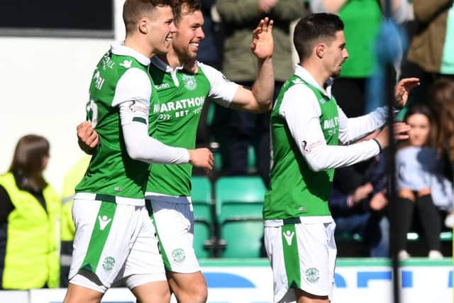 Hibernian's Steven Whittaker celebrates his goal with team-mates. SNS/Craig Williamson