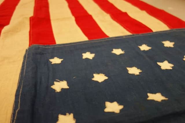 The flag, which was sewn in less than a day in time for the first mass burial, was later gifted to the Smithsonian Museum in Washington. PIC: Caledonia TV.