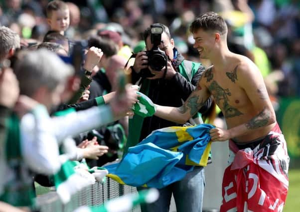 Mikael Lustig meets with Celtic fans after helping the club to secure another title. Picture: PA