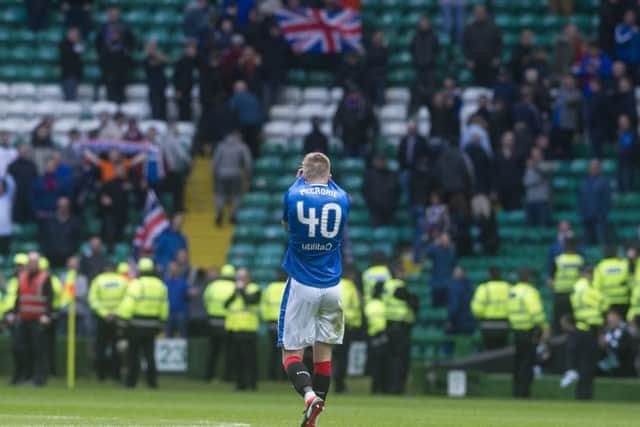 Ross McCrorie hides his face in despair as he trudges towards the few Rangers supporters still in the ground at
full-time. Picture: John Devlin.