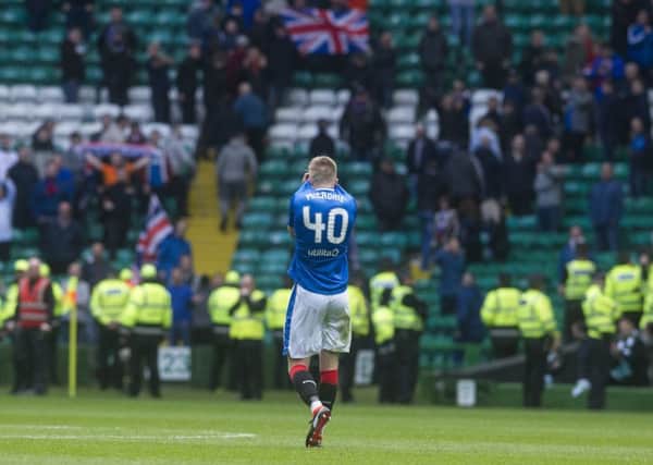 Ross McCrorie hides his face in despair as he trudges towards the few Rangers supporters still in the ground at 
full-time. Picture: John Devlin.