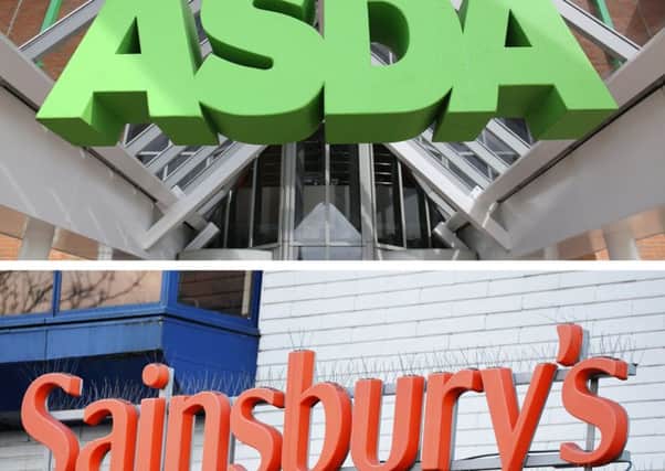 The competition watchdog is being urged to investigate the possible merger of the two supermarket retailers amid concerns over consumer choice. Picture: PA