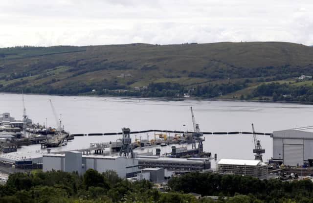 Submarines are seen alongside the jetty at the Royal Navy's base at Faslane. (Picture: Getty)
