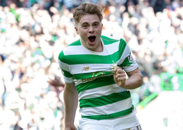 James Forrest celebrate as he gives Celtic a 3-0  lead over Rangers on Sunday.