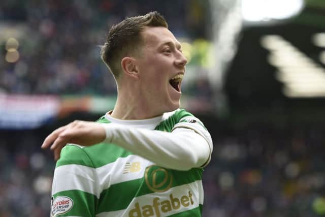 Callum McGregor celebrates after scoring the fifth Celtic goal against Rangers.