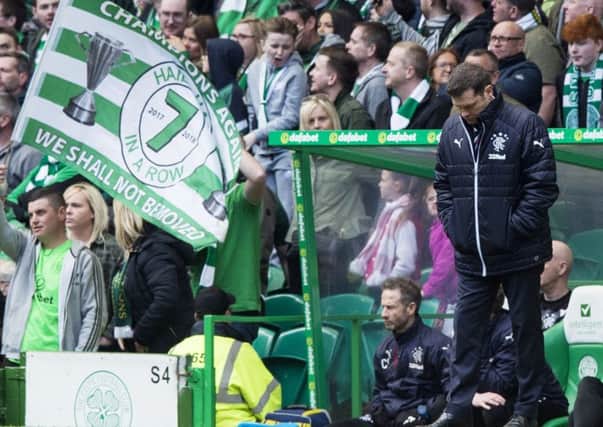 A crestfallen Graeme Murty 
on the touchline during Rangers
 
5-0 humiliation at Celtic.