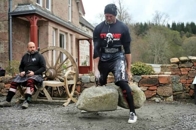 James Crossley, who starred as Hunter in television show Gladiators, now holds the record for lifting the Dinnie Stones.