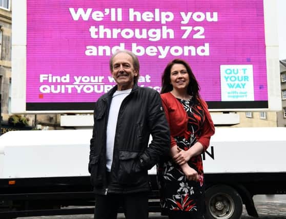 Public Health Minister Aileen Campbell and former Bay City Rollers lead singer Gordon "Nobby" Clark at Edinburghs Grassmarket to highlight the free smoking cessation advice offered by Scotlands Quit Your Way service. Picture: Lisa Ferguson