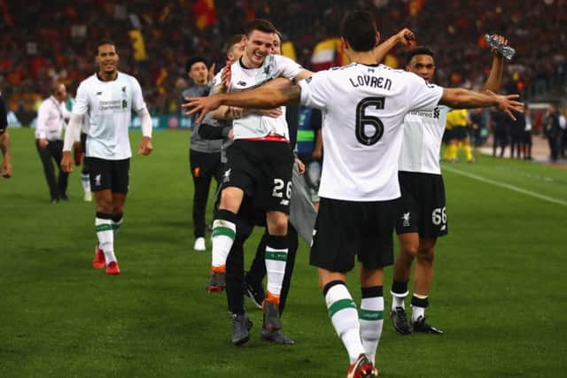 Andrew Robertson celebrates with his Liverpool team-mates after helping them qualify for the Champions League final following a 4-2 defeat against Roma. Liverpool won 7-6 on aggregate. Picture: Julian Finney/Getty Images