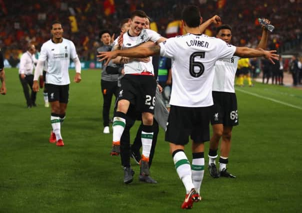 Andrew Robertson celebrates with his Liverpool team-mates  after helping them qualify for the Champions League final following a 4-2 defeat against Roma. Liverpool won 7-6 on aggregate.  Picture: Julian Finney/Getty Images