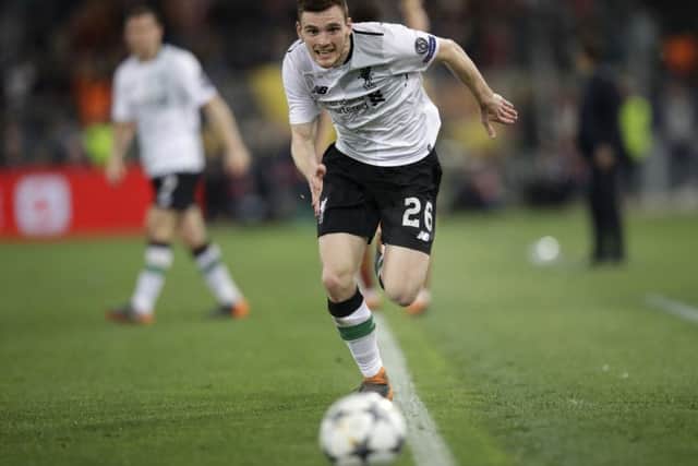 Andy Robertson hunts down the ball during the Champions League semi-final clash against Roma. Picture: AP